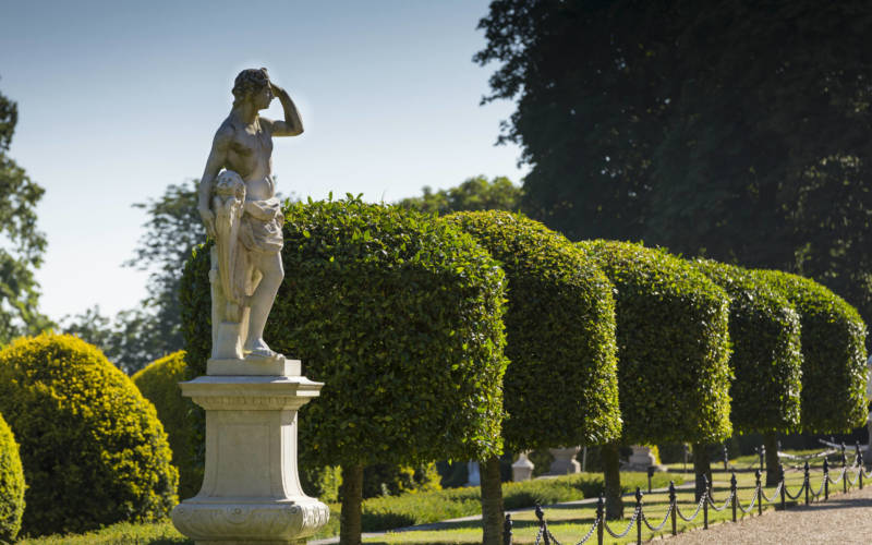 Statue and clipped hedging on the parterre