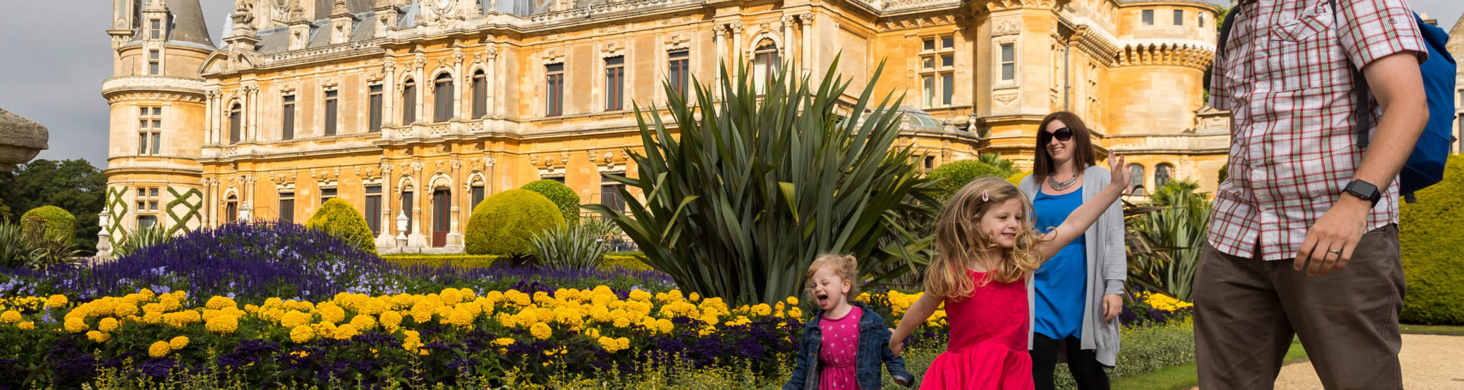 Family walking round the South front Parterre