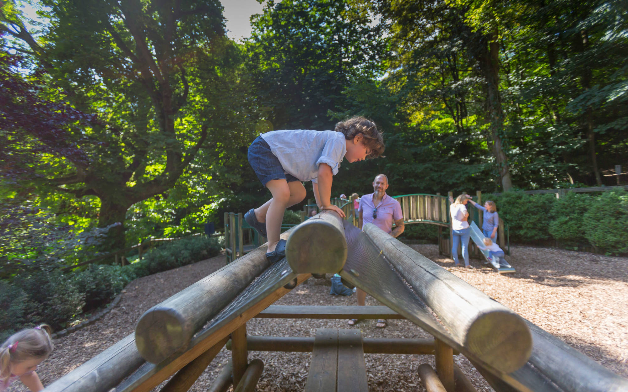 A young visitor using the climbing frame