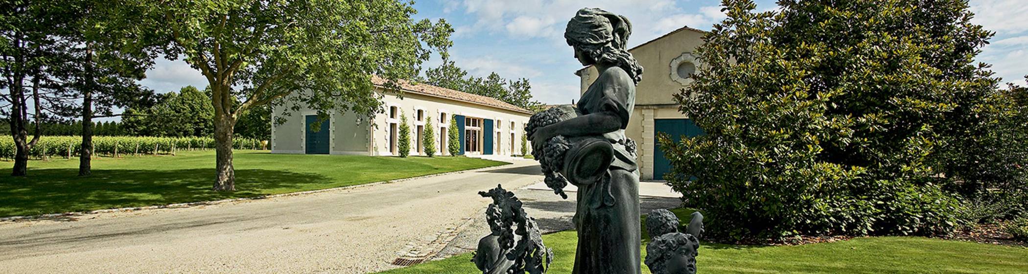 Chateaue Clarke estate buildings with sculpture in the foreground