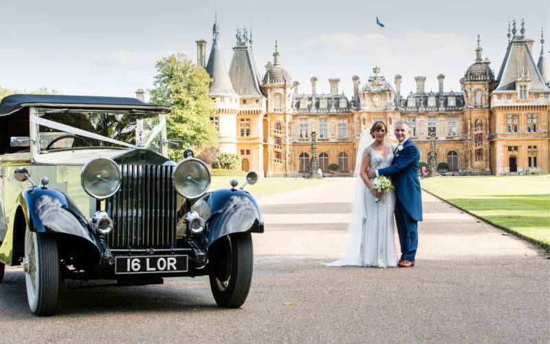A couple pose in the driveway of Waddesdon Manor